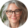 A woman wearing glasses and a scarf, exuding a sense of style and sophistication.